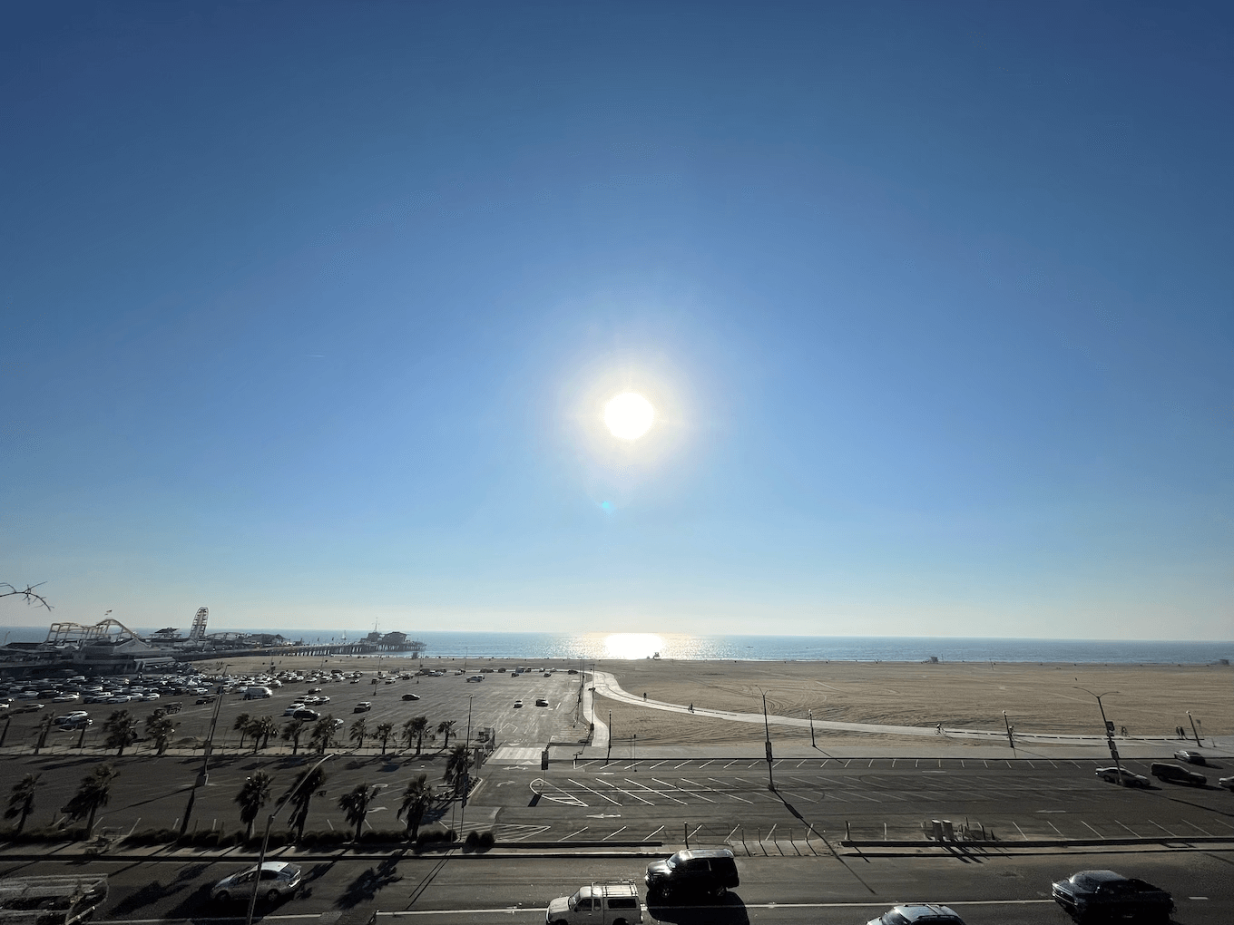 Ultra Wide shot of sun over the ocean with a lens flare.