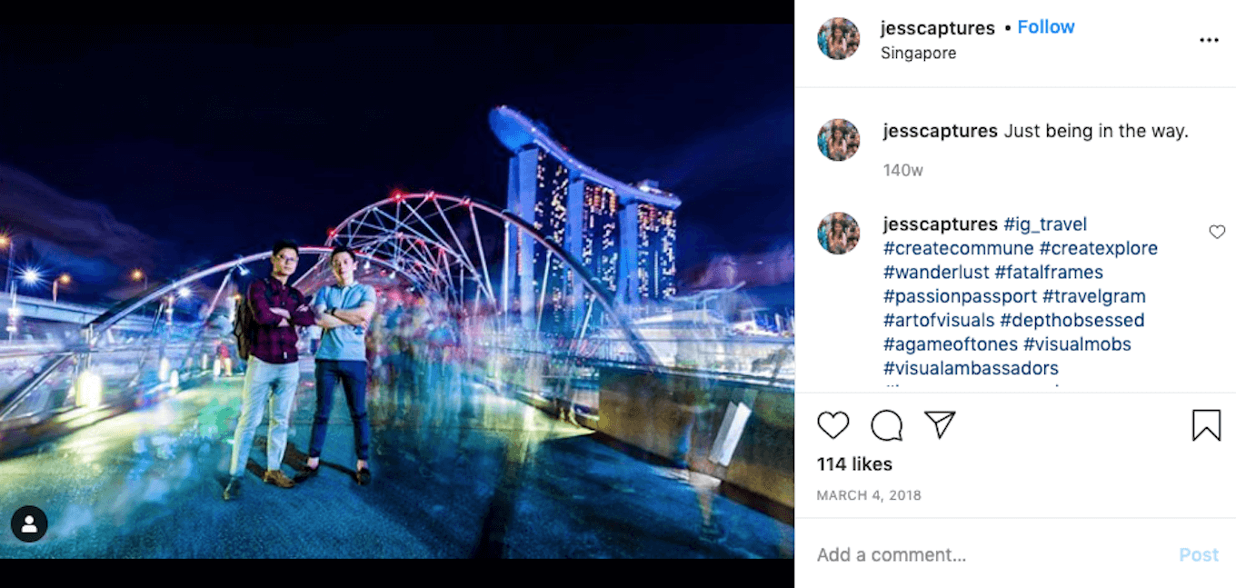 An Instagram screenshot featuring a long exposure shot of a crowd of people in front of a Singapore landmark