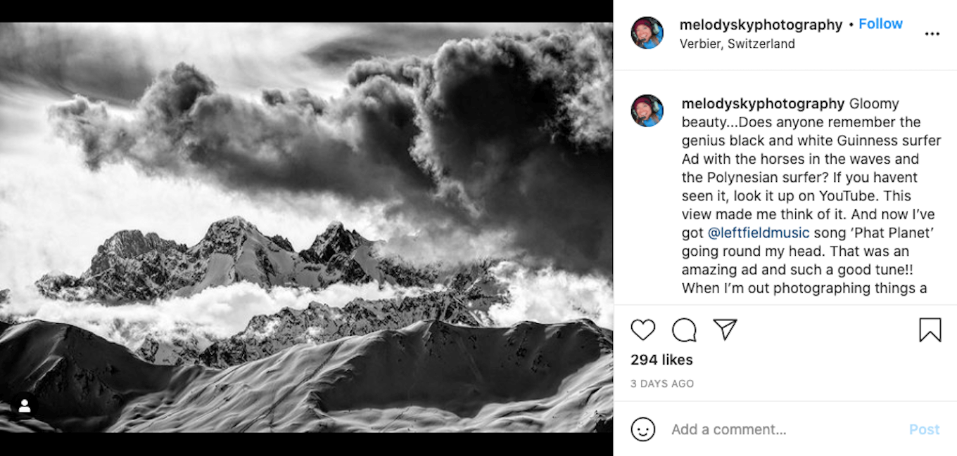 An Instagram screenshot featuring a black-and-white image of mountains with a very cloudy sky.