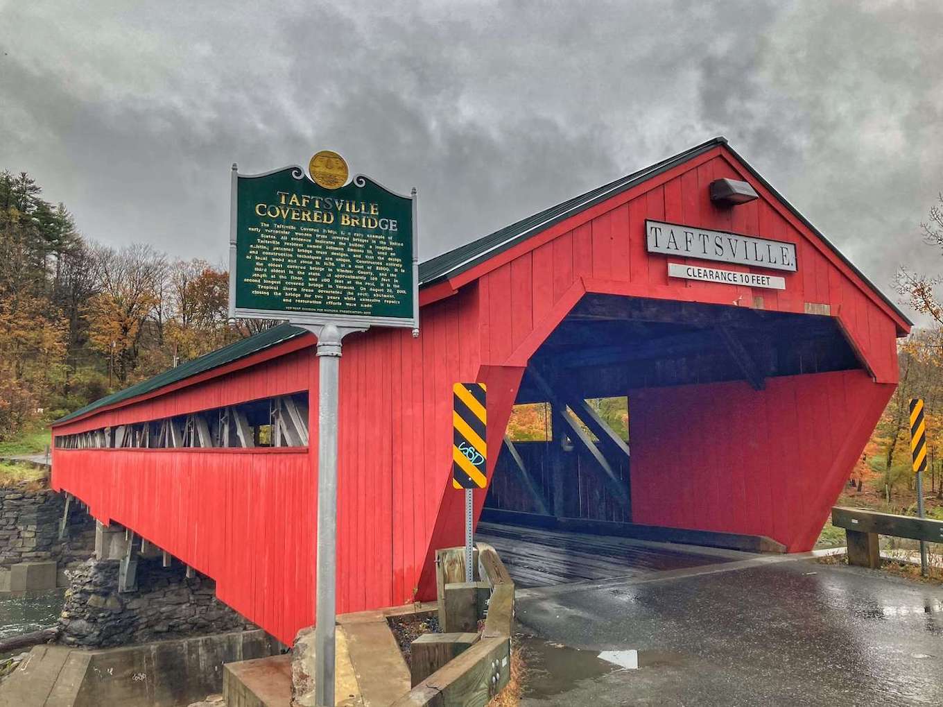 A red covered bridge in Vermont, showing diagonal lines in photography.