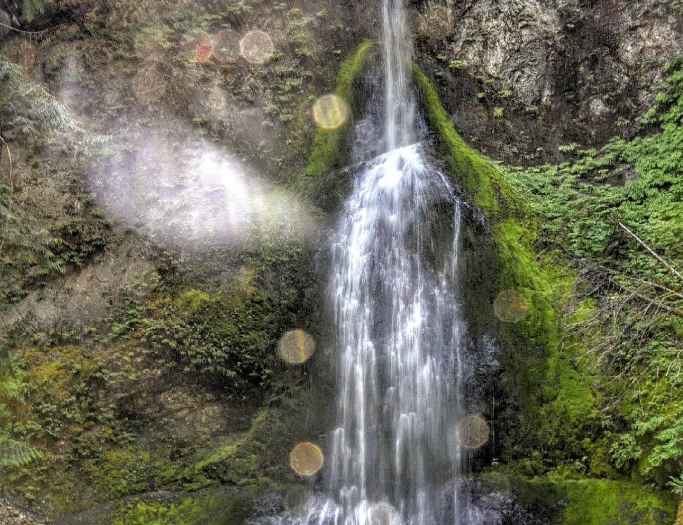 An image of a waterfall in the sunlight, showing an example of lens flares.