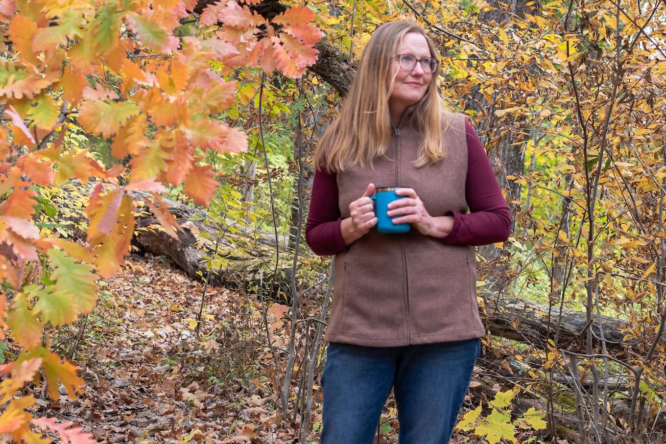 A fall portrait taken on a wooded trail.