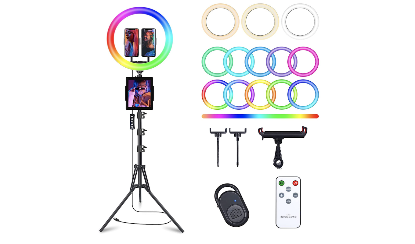 A rainbow colored selfie ring light on a tripod with included accessories.