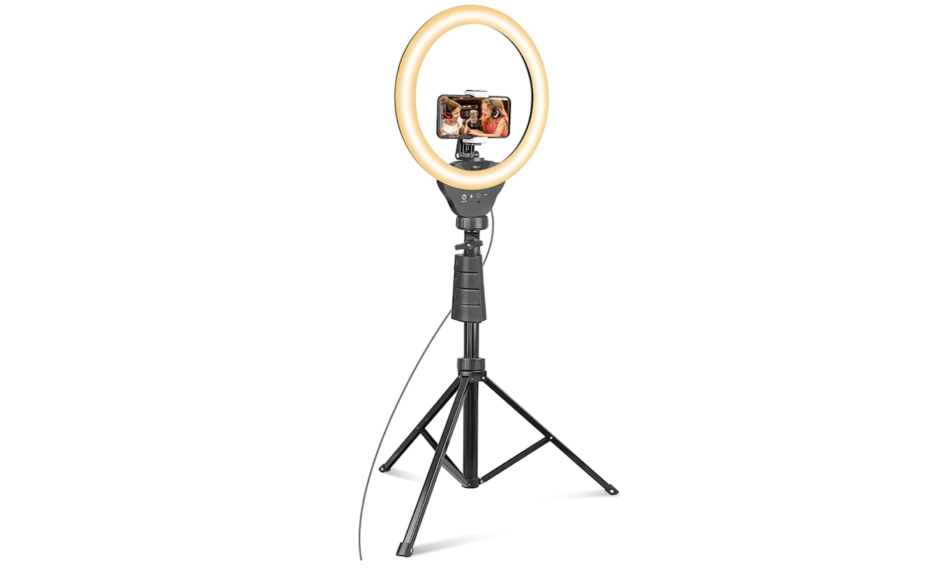 A selfie ring light mounted on a tripod.