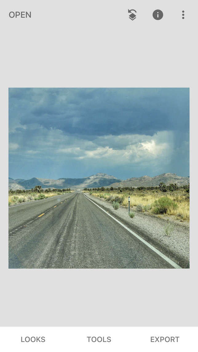 The before shot of a double exposure image showing a road through the desert.